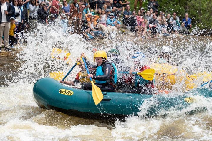 a group of people on a raft in the water